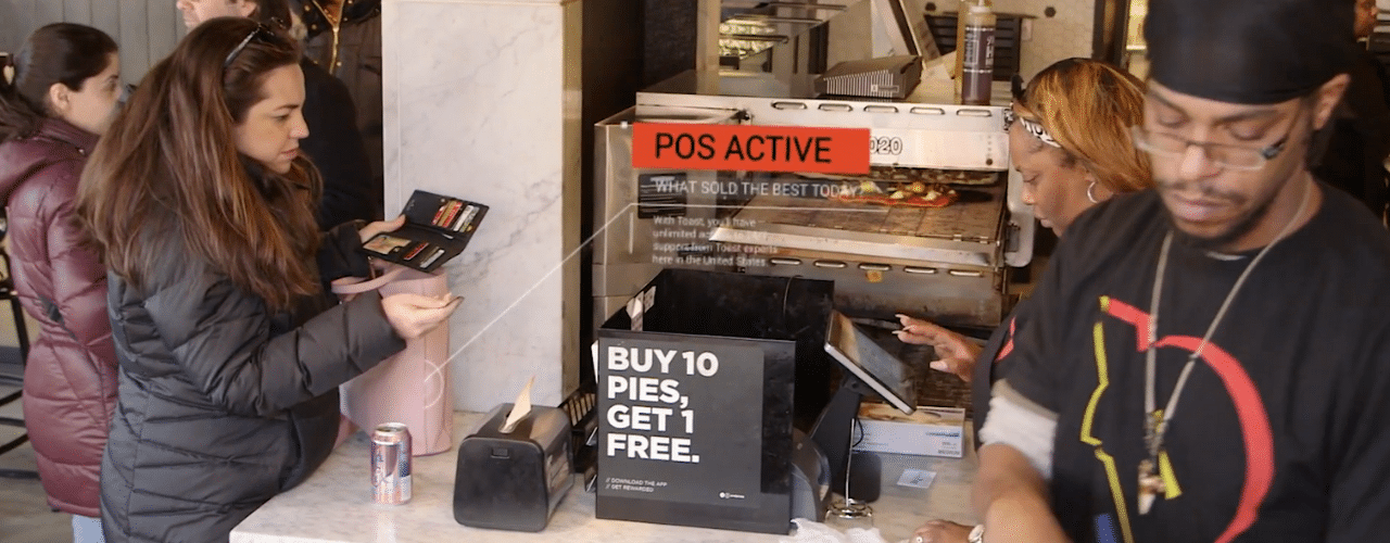 Customer making a transaction at the POS system.