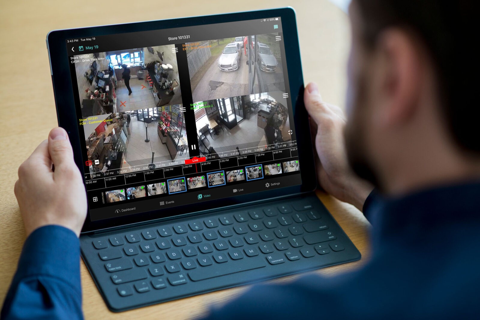 A man looking at a tablet.