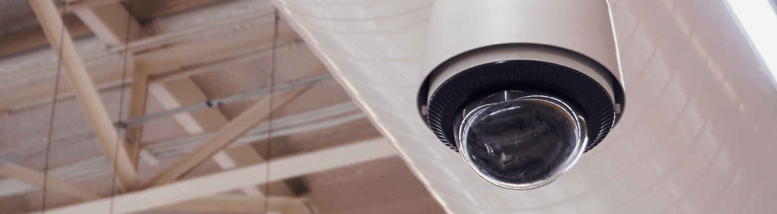 Security camera mounted on ceiling.