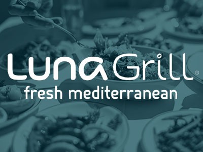 Luna Grill logo with food in the background.
