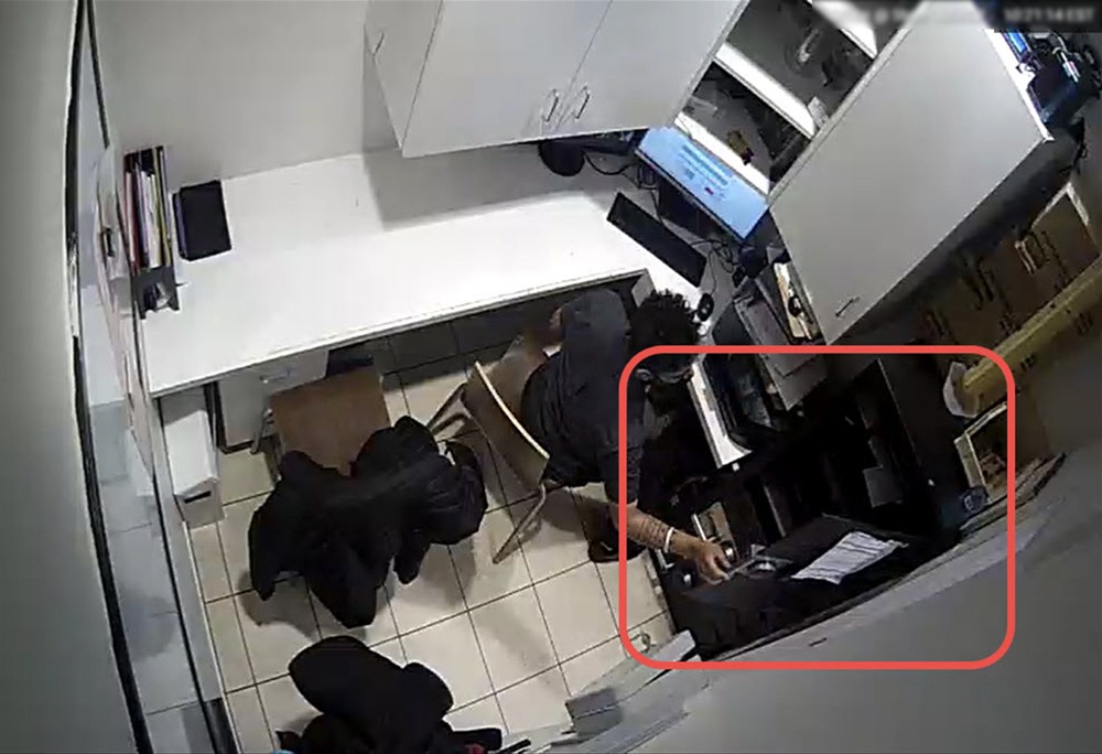 A person is standing in a room with a camera.
