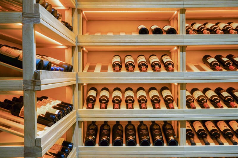 cellar-with-bottles (1) A wine cellar with many bottles of wine.
