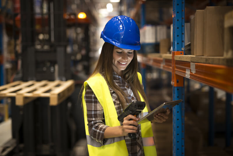 worker-holding-tablet-bar-code-scanner-checking-inventory-distribution-warehouse