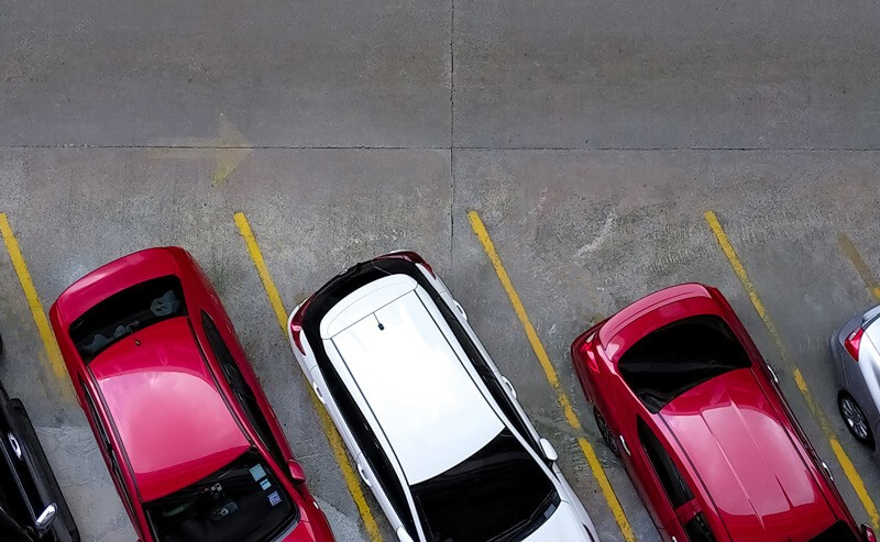 This is an overhead security camera view of a parking lot. Solink can help reduce business liability in parking lots by deterring crime and providing evidence of incidents when they do occur.