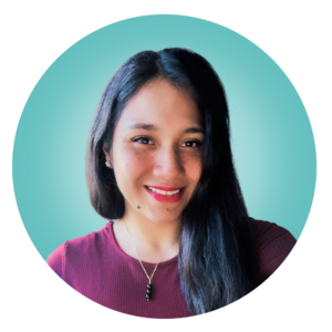 A person with long dark hair and a red top smiles at the camera. The background is teal.