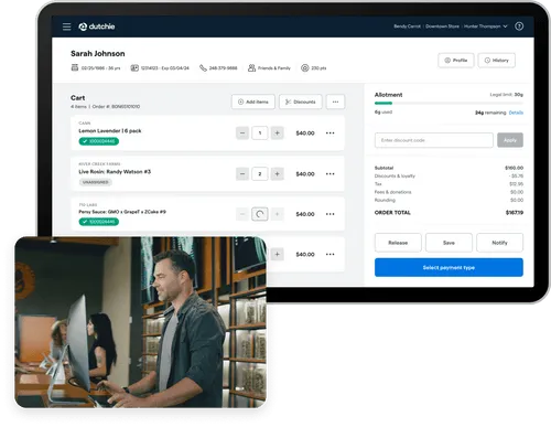A computer screen displays an online shopping cart interface, while a man works at a standing desk in a modern office.
