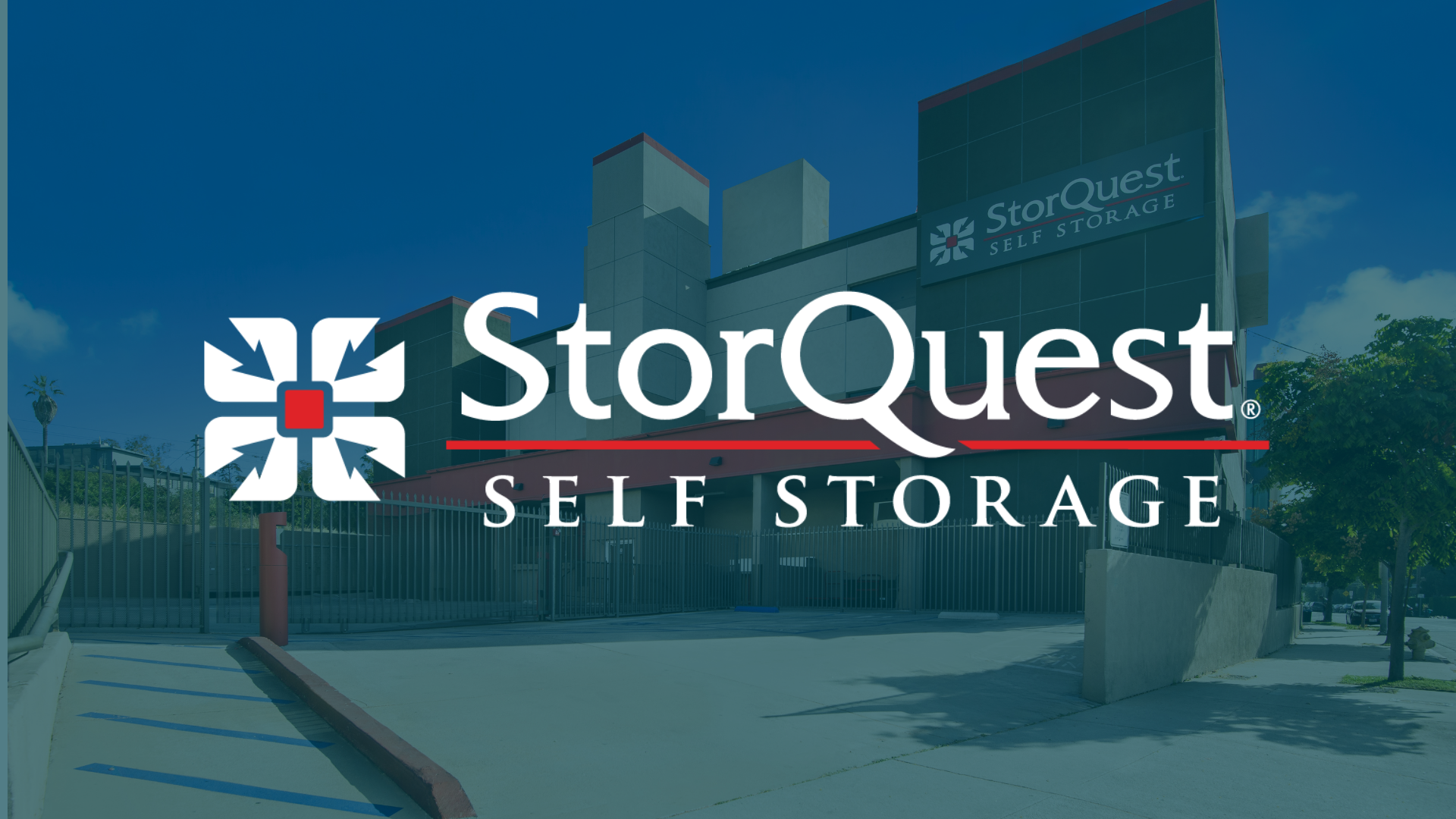 Exterior of a StorQuest Self Storage facility with branding visible on the building.