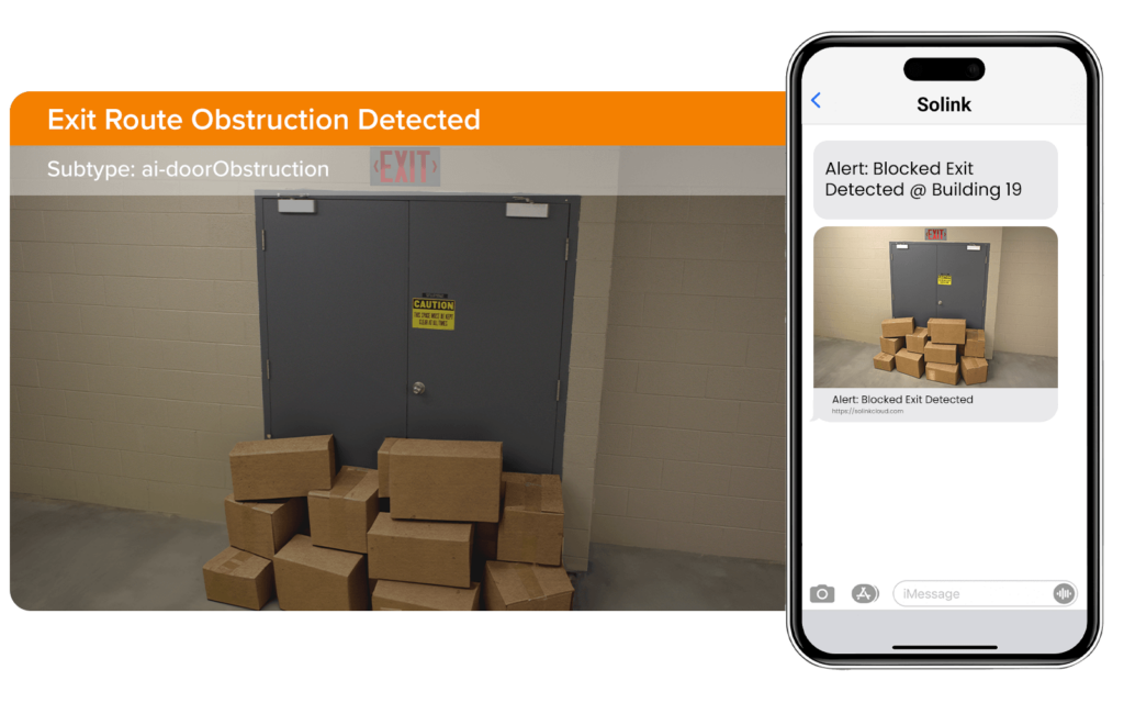 Boxes blocking a door with an "Exit Route Obstruction Detected" alert displayed on a smartphone screen.