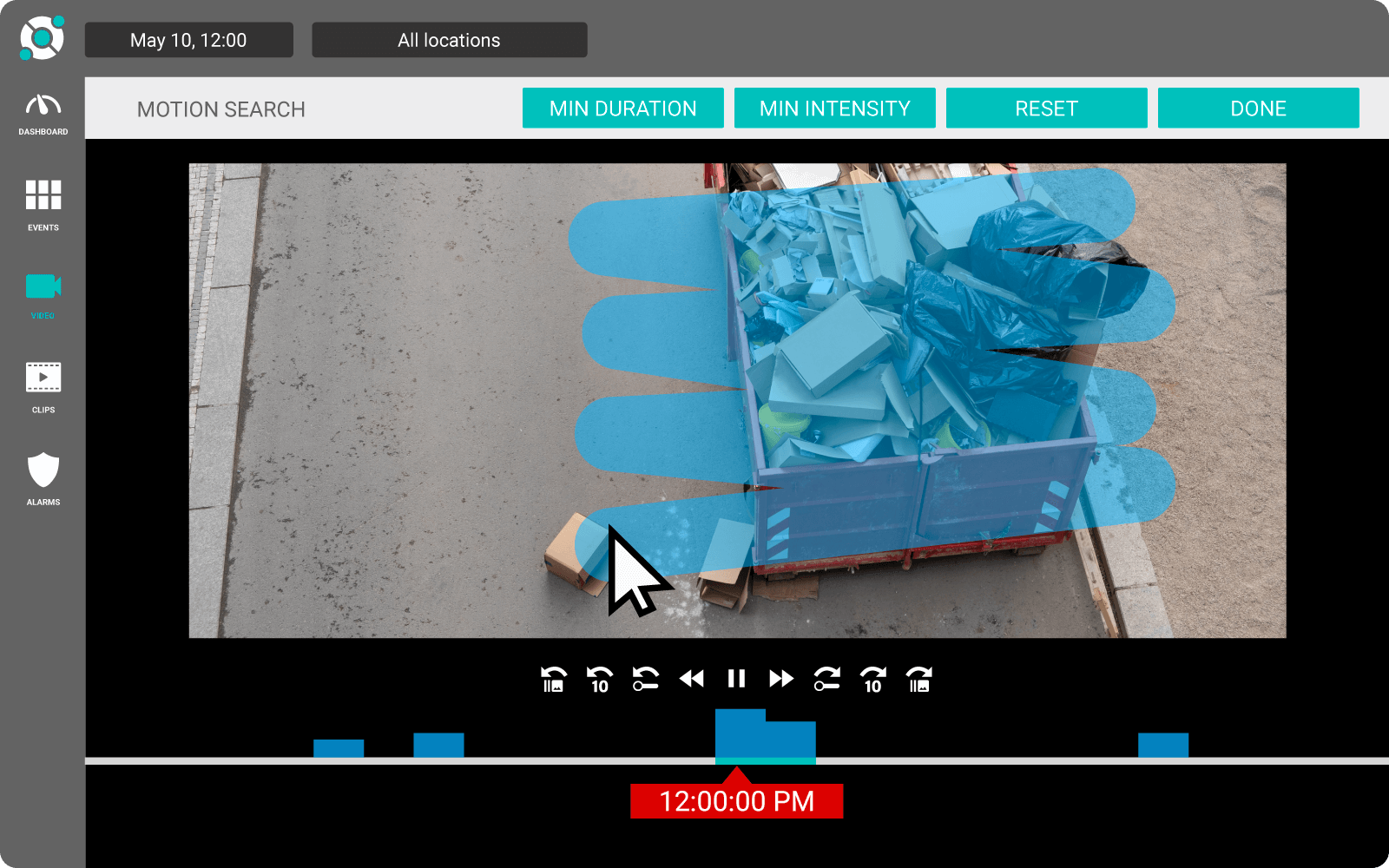 A computer interface displays surveillance footage of a blue dumpster filled with various items. A cursor hovers over an item outside the dumpster.