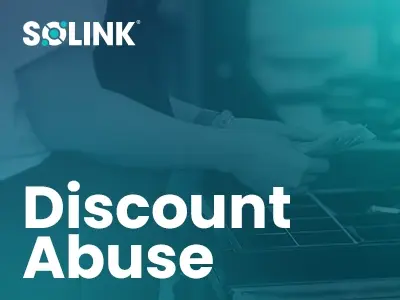 A person handling cash at a register with the text "Discount Abuse" and "Solink" logo overlaid.