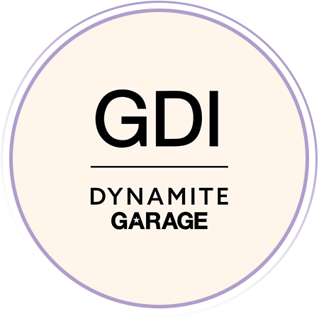 Logo with the text "GDI" above a line, and "DYNAMITE GARAGE" below, inside a circular border on a light background.