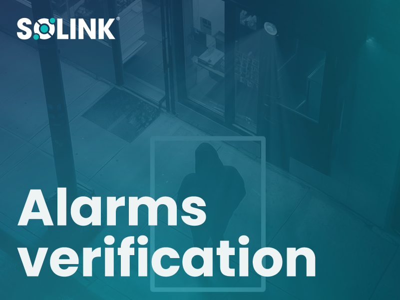 Overhead view of a hooded person outside a building entrance with the words "Alarms verification" and the Solink logo overlaid.