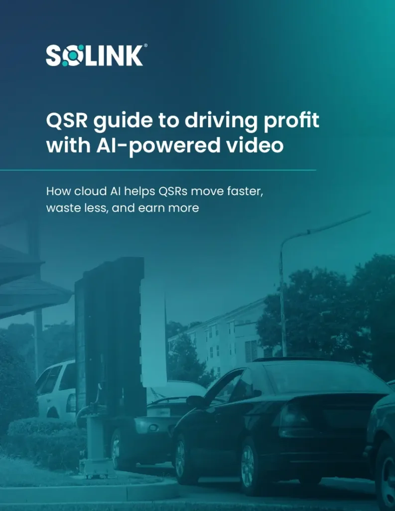 A drive-thru lane with cars waiting; the Solink QSR guide discusses how cloud AI video helps quick service restaurants increase profit, efficiency, and reduce waste.