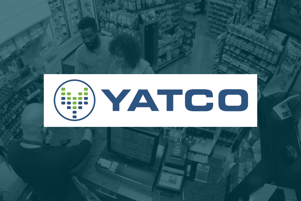 A cashier assists two customers at a store counter, with the YATCO logo displayed prominently over the image.
