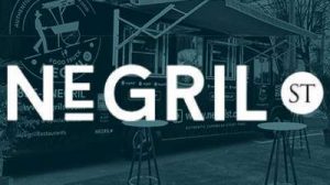 Negril St logo with a blue overlay in the background